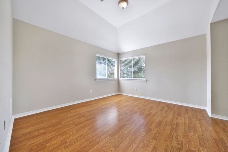 3206 Summer Bay Drive Sugar Land, TX 77478 - Photo 34 of 43 an empty room with wooden floor and windows