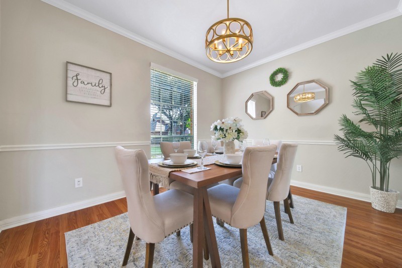 3206 Summer Bay Drive Sugar Land, TX 77478 - Photo 9 of 43 a view of a dining room with furniture and chandelier
