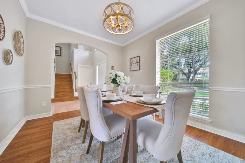 3206 Summer Bay Drive Sugar Land, TX 77478 - Photo 10 of 43 a view of a dining room with furniture window and wooden floor
