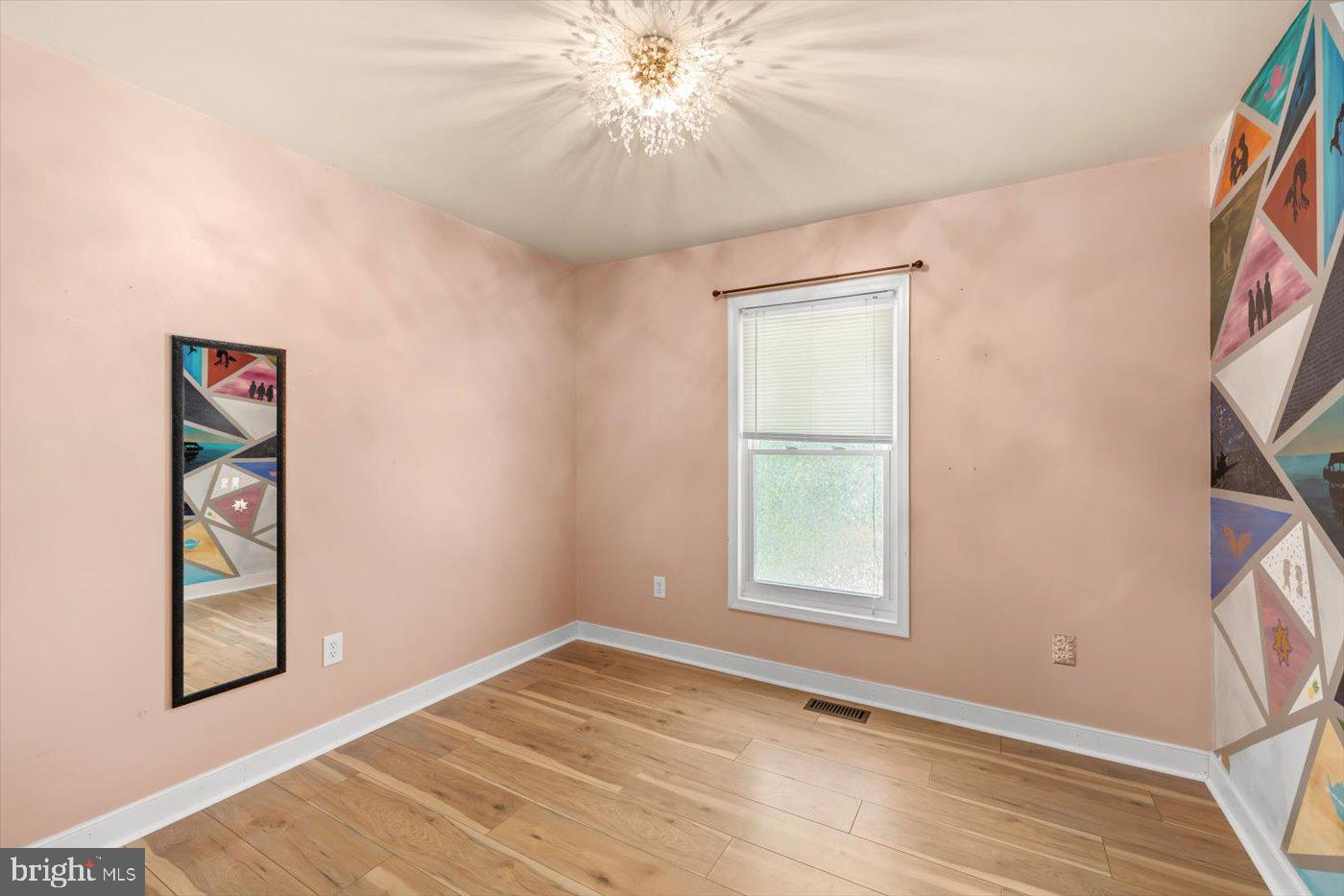 975 Swan Lane Ruther Glen, VA 22546 - Photo 18 of 42 an empty room with windows and fan