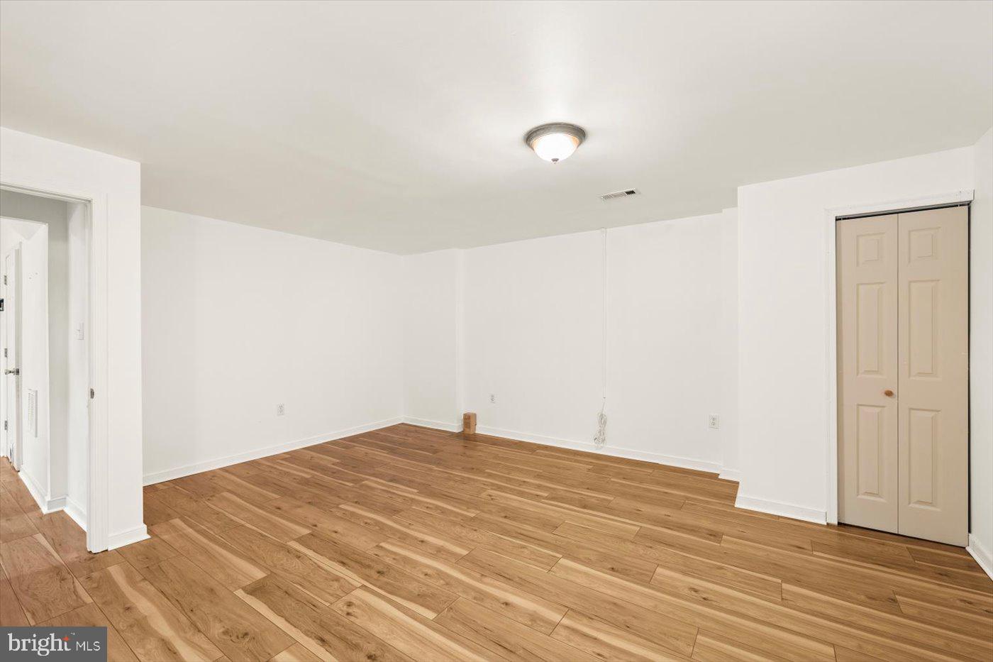 975 Swan Lane Ruther Glen, VA 22546 - Photo 26 of 42 a view of empty room with wooden floor