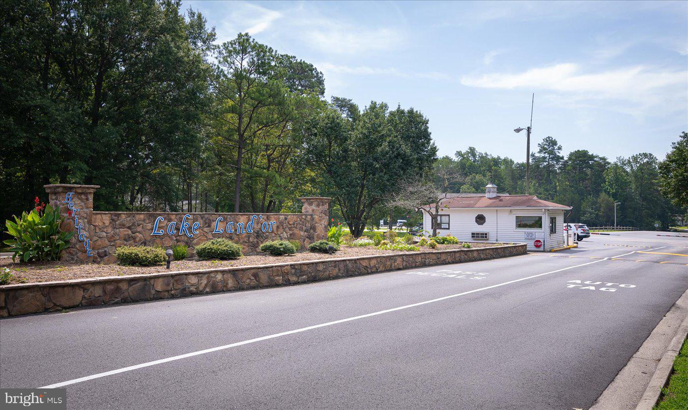 975 Swan Lane Ruther Glen, VA 22546 - Photo 42 of 42 a front view of a house with a garden and trees
