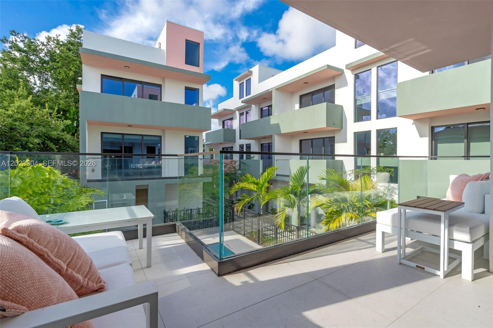 721 Southwest 11th Street, Unit G Miami, FL 33129 - Photo 26 of 40 a view of backyard with outdoor seating and a potted plant