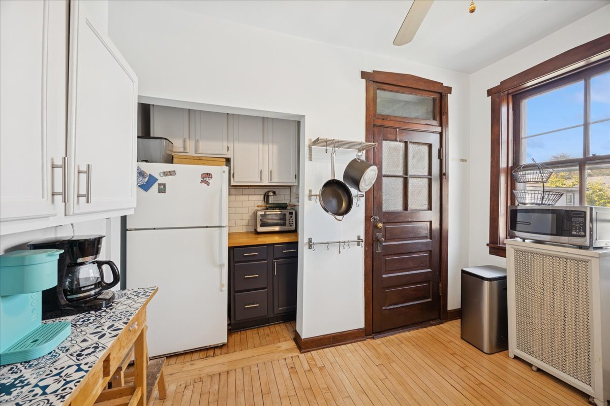 642 Van Buren Street, Unit 2 Oak Park, IL 60304 - Photo 12 of 23 a kitchen with a refrigerator and a stove top oven