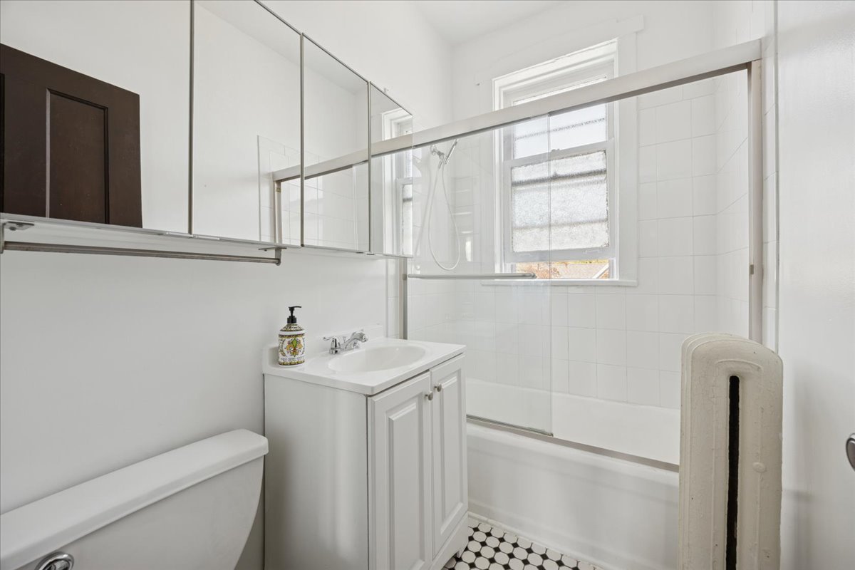 642 Van Buren Street, Unit 2 Oak Park, IL 60304 - Photo 14 of 23 a bathroom with a sink a toilet and shower