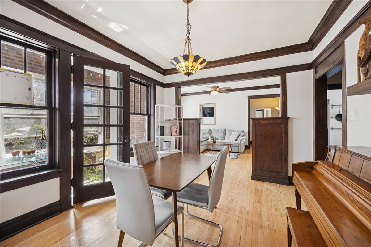 642 Van Buren Street, Unit 2 Oak Park, IL 60304 - Photo 15 of 23 a view of a dining room with furniture window and wooden floor