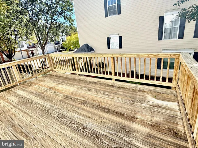 a view of a balcony with wooden floor