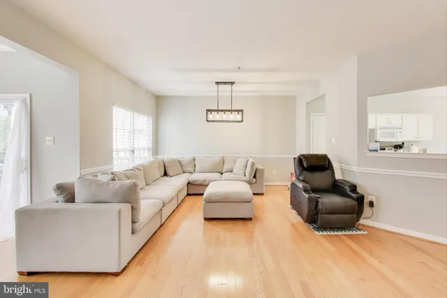 a living room with furniture window and a flat screen tv