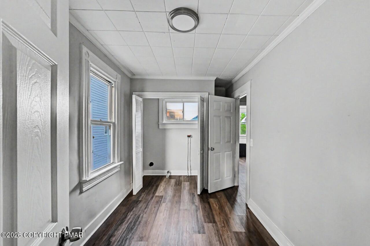 432 Edwards Court Scranton, PA 18504 - Photo 16 of 34 a view of a hallway with wooden floor and staircase
