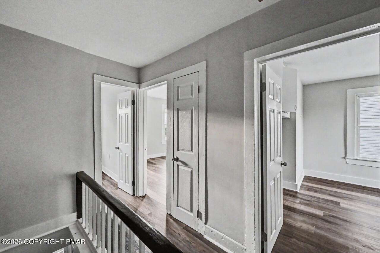 432 Edwards Court Scranton, PA 18504 - Photo 21 of 34 a view of a hallway with wooden floor and staircase