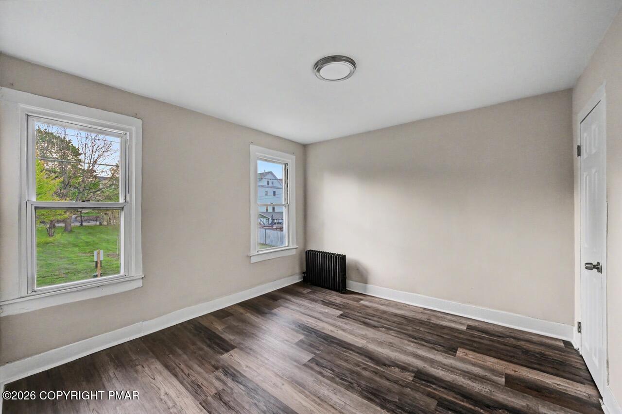 432 Edwards Court Scranton, PA 18504 - Photo 27 of 34 a view of empty room with wooden floor and fan