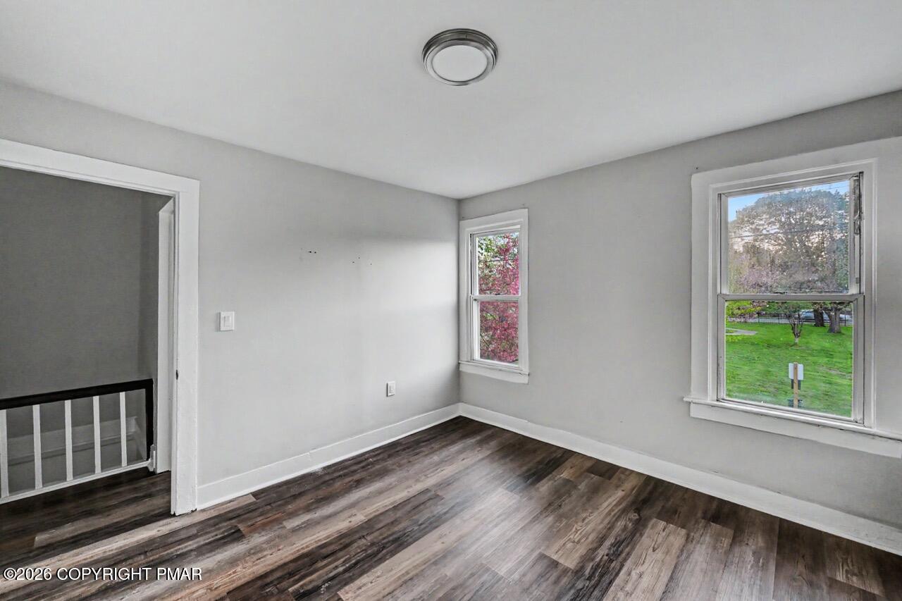 432 Edwards Court Scranton, PA 18504 - Photo 29 of 34 a view of an empty room with wooden floor and a window