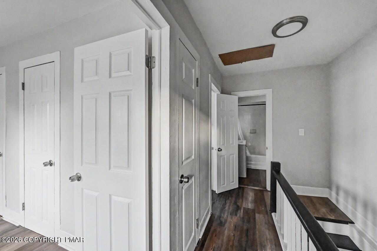 432 Edwards Court Scranton, PA 18504 - Photo 30 of 34 a view of a hallway with wooden floor and staircase