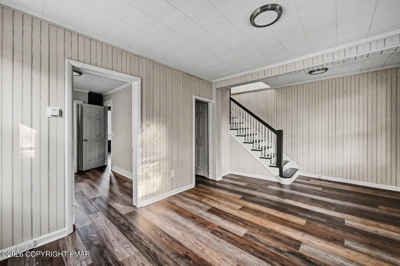 432 Edwards Court Scranton, PA 18504 - Photo 5 of 34 a view of a hallway with wooden floor and staircase