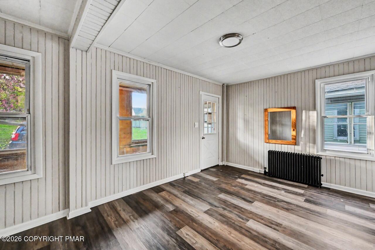 432 Edwards Court Scranton, PA 18504 - Photo 7 of 34 a bedroom with a bed and wooden floor