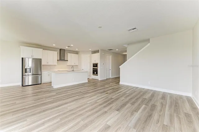 a view of kitchen view wooden floor and window