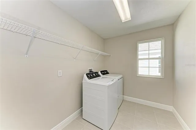 a utility room with a window dryer and washer