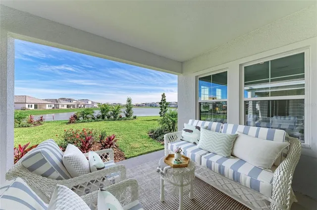a view of a patio with couches chairs and yard