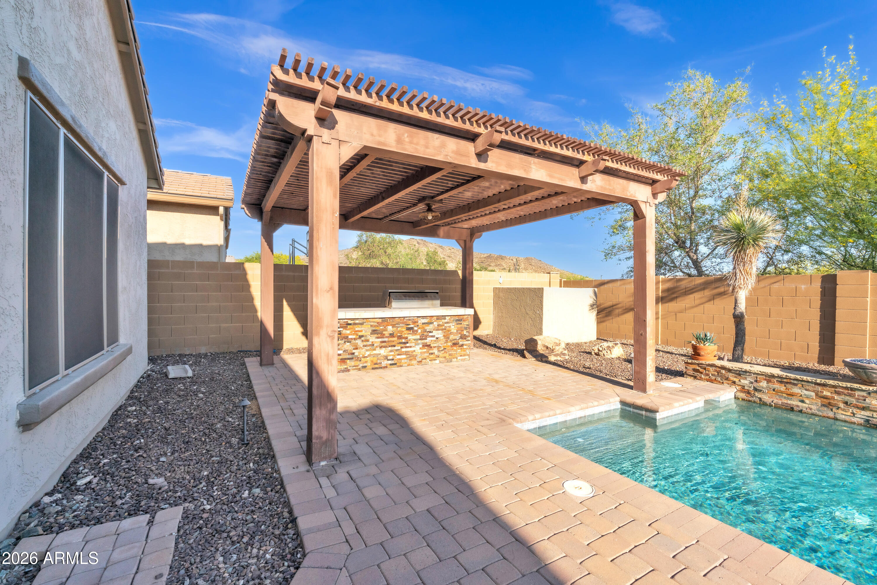 1615 West Red Fox Road Phoenix, AZ 85085 - Photo 50 of 64 a view of a backyard with sitting area