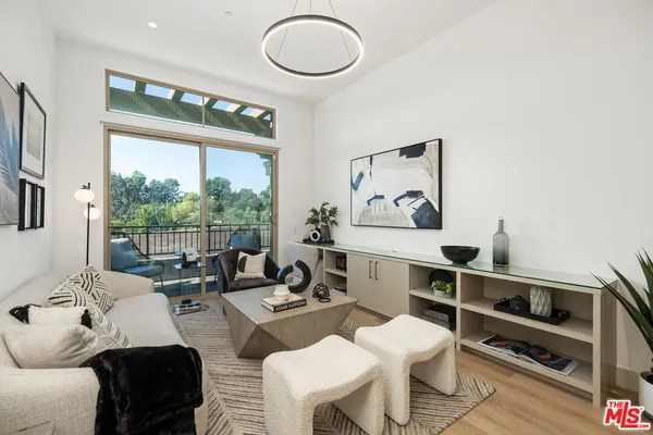 a living room with furniture and white walls
