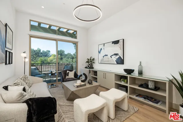 a living room with furniture and white walls