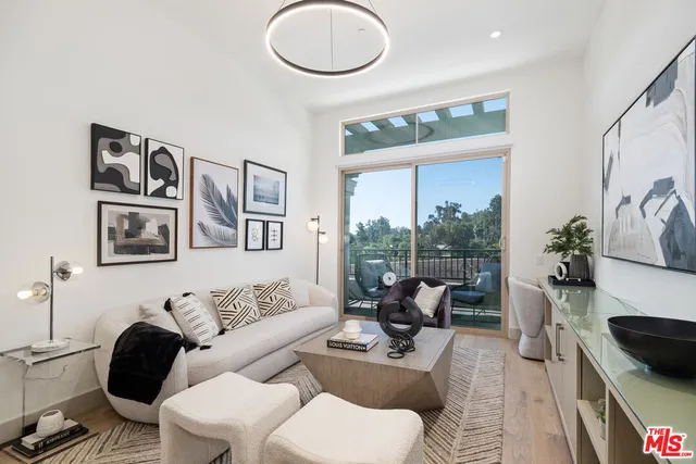 a balcony with wooden floor and city view