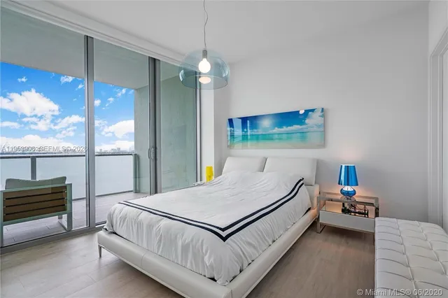 a bathroom with double sink and a mirror