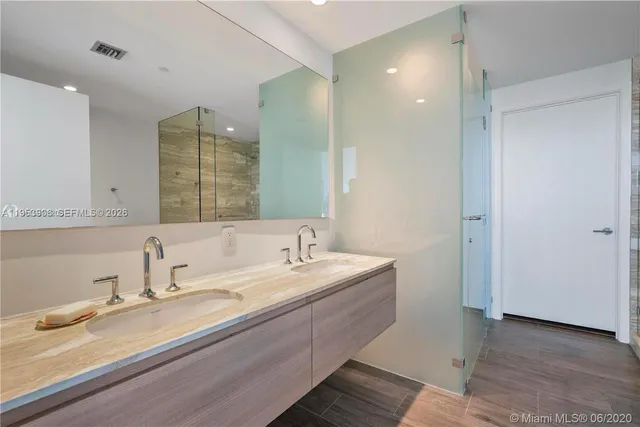a bathroom with a bathtub and shower