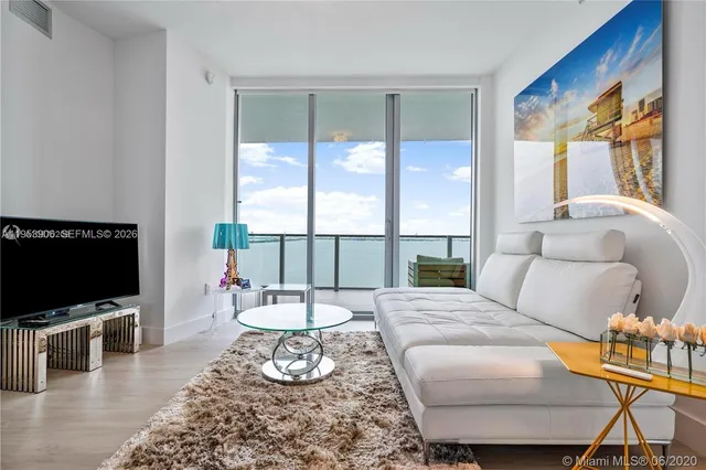 a kitchen with stainless steel appliances a stove microwave and sink