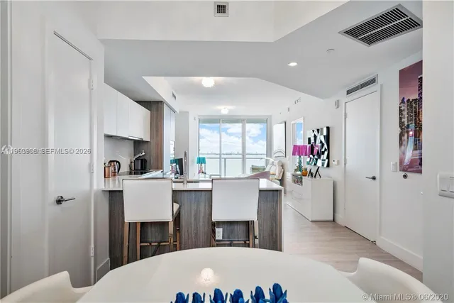 a view of kitchen with furniture and wooden floor