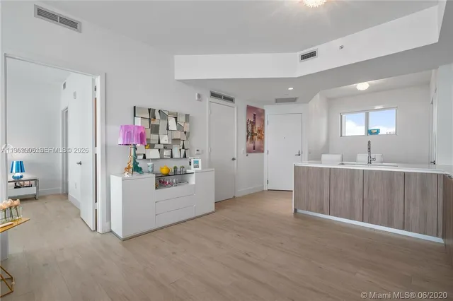 a living room with furniture a window and gym equipment