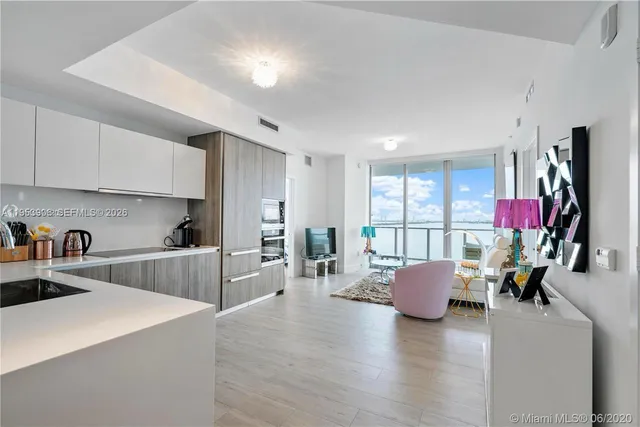 a kitchen with cabinets and white stainless steel appliances