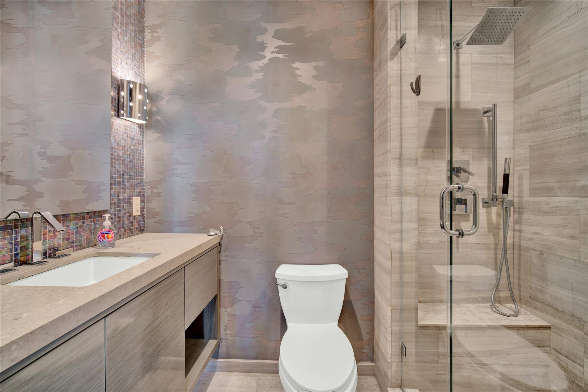 425 North Ocean Boulevard, Unit 3 Boca Raton, FL 33432 - Photo 56 of 69 a bathroom with a toilet sink and shower