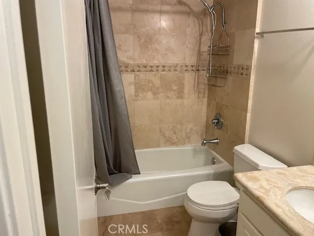 a bathroom with a bathtub and a toilet