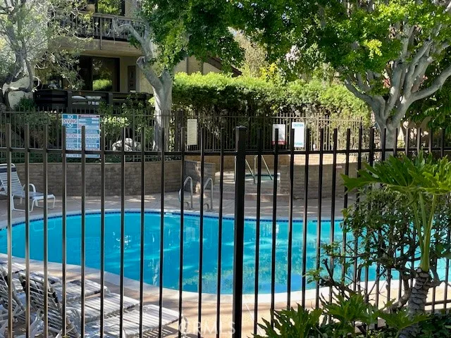 a view of a house with a iron gate