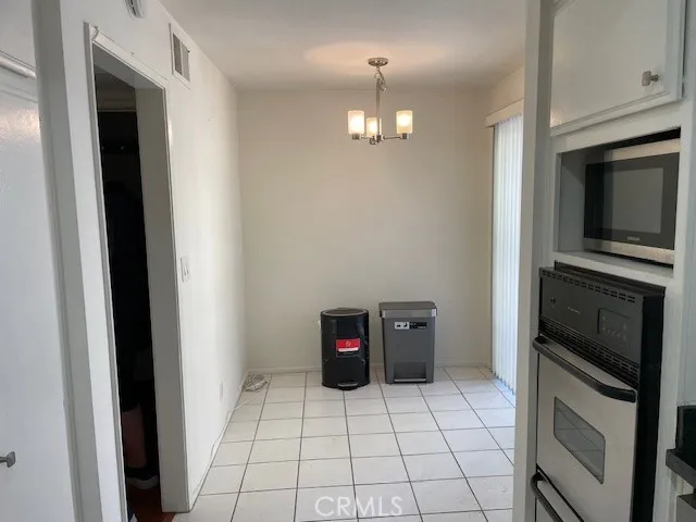 a kitchen with a sink and a stove top oven