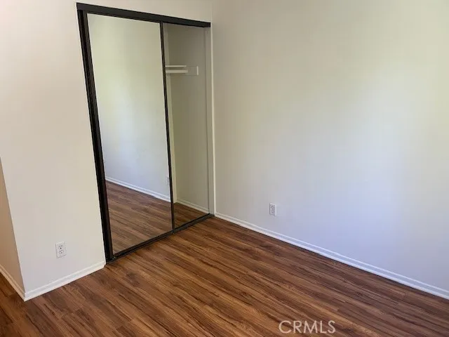 an empty room with wooden floor