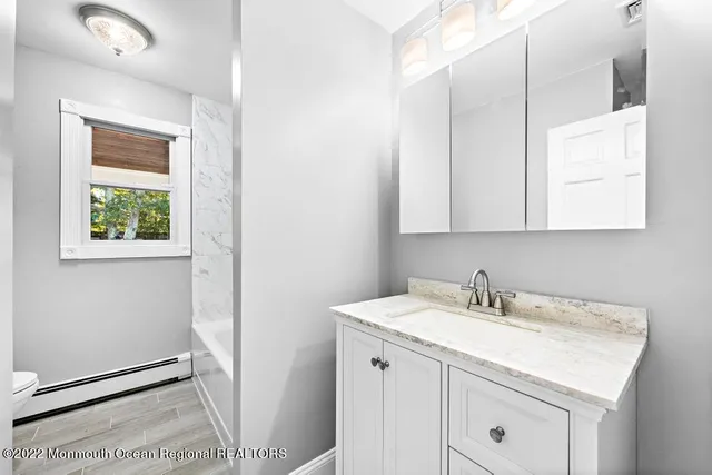 a bathroom with bathtub and shower