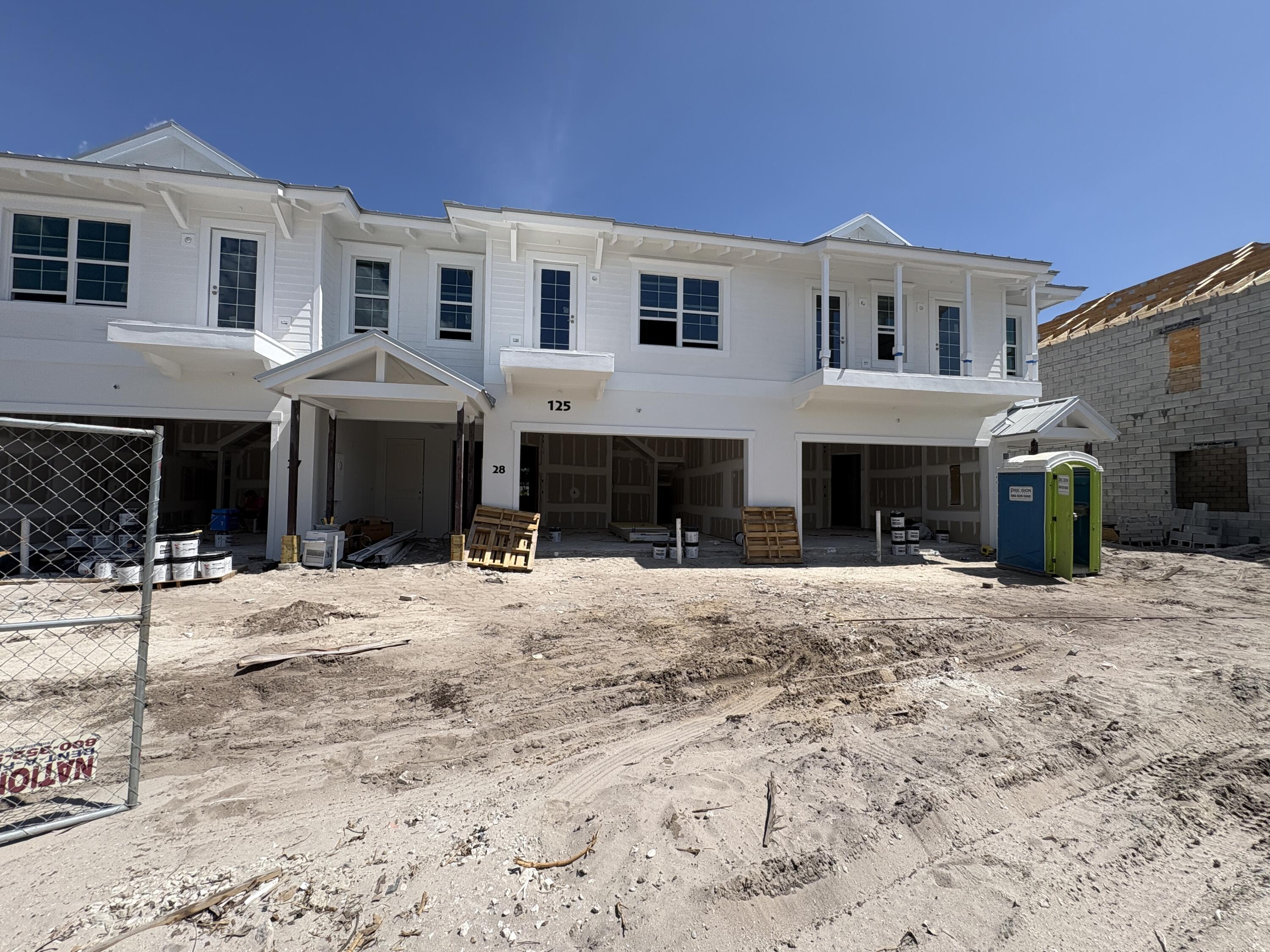 125 Water Pointe Place, Unit 28 Jupiter, FL 33477 - Photo 5 of 19 a front view of a house with a yard