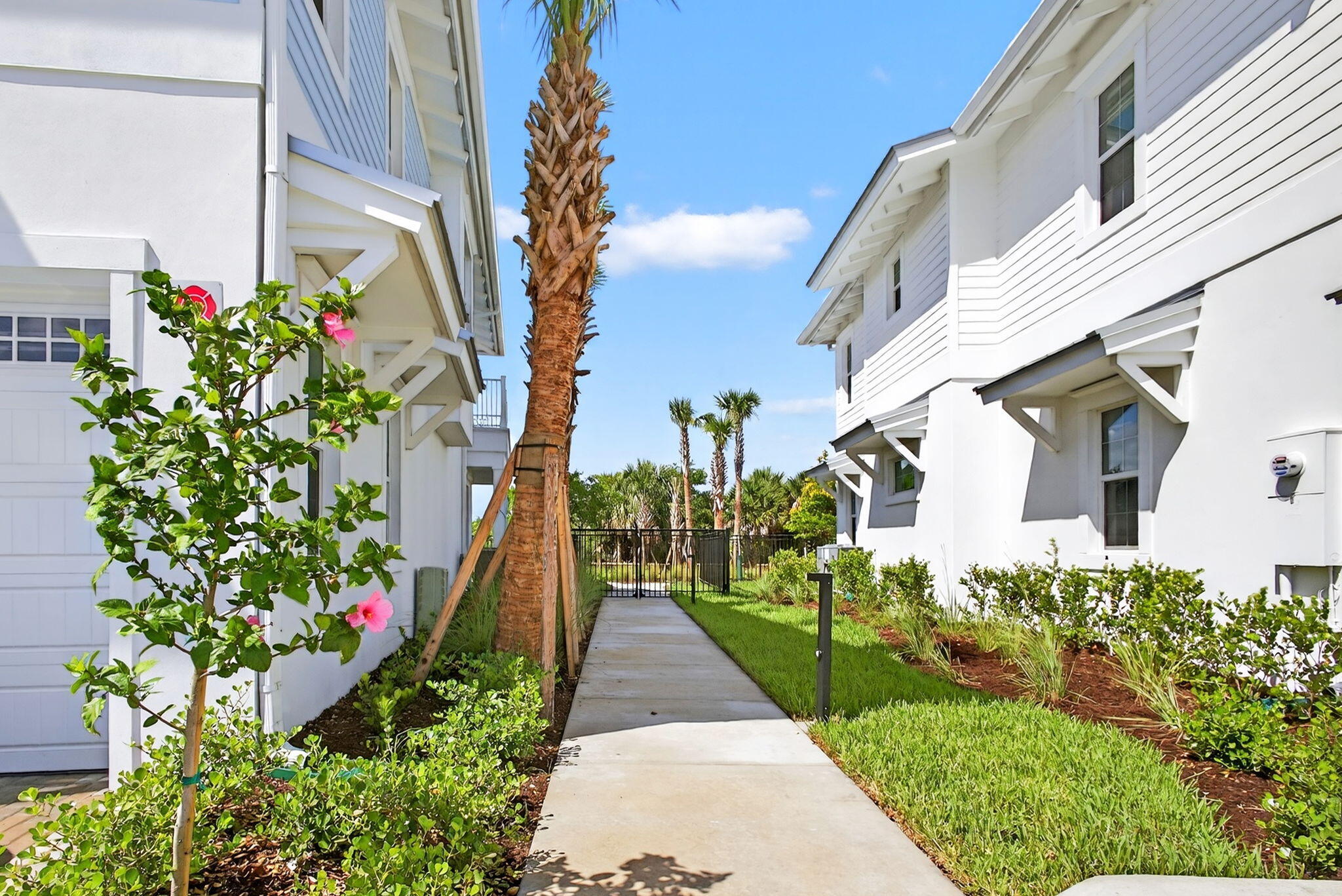 125 Water Pointe Place, Unit 28 Jupiter, FL 33477 - Photo 9 of 19 a view of a garden with pathway