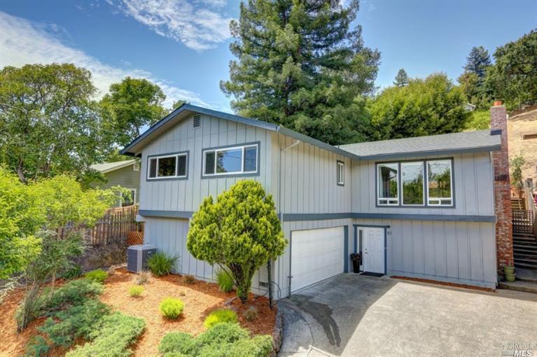83 Butterfield Road San Anselmo, CA 94960 - Photo 1 of 1 a view of a house with a backyard and a tree