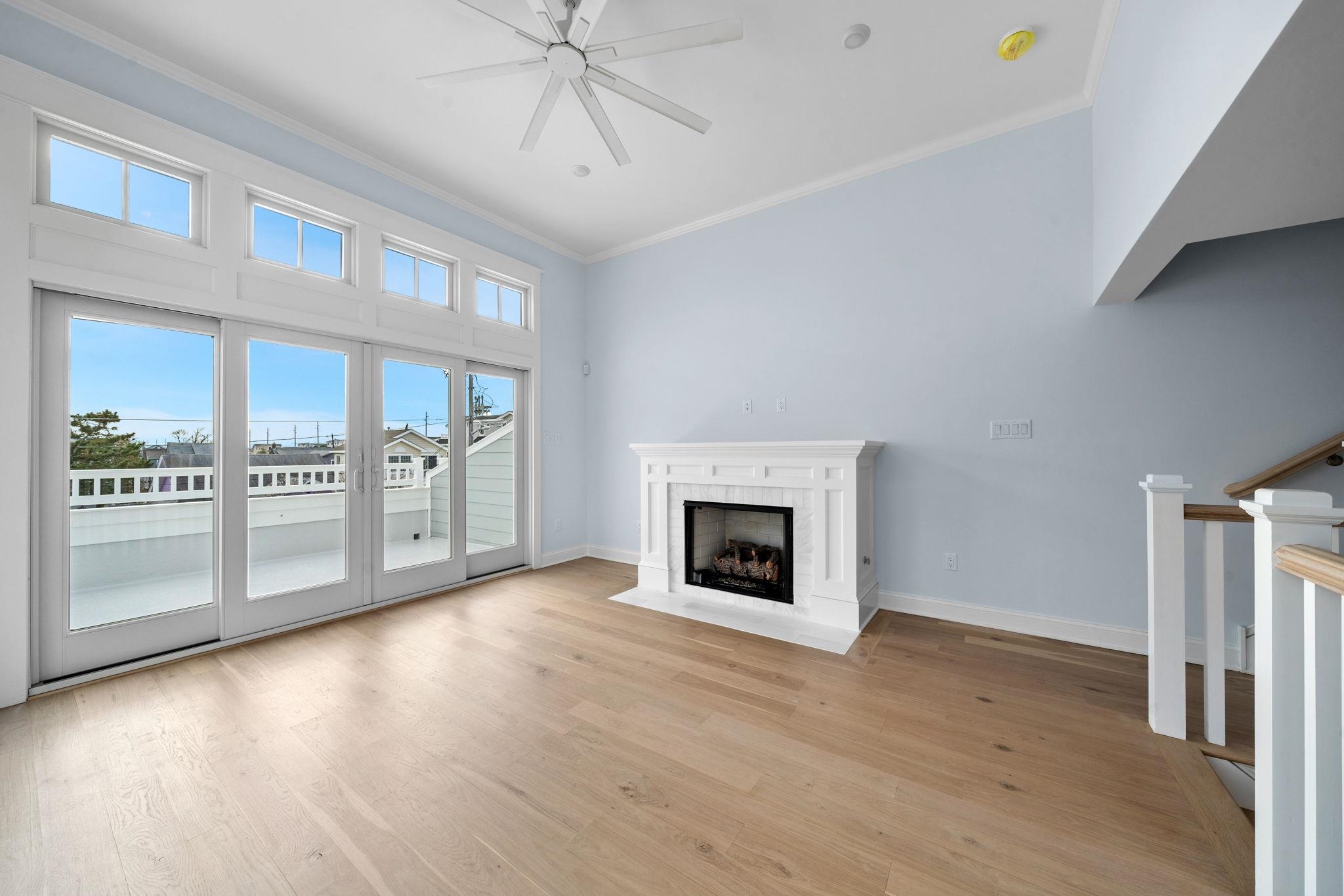 249 35th Street, Unit EAST SIDE Avalon, NJ 08202 - Photo 12 of 45 a view of an empty room with a kitchen and a window