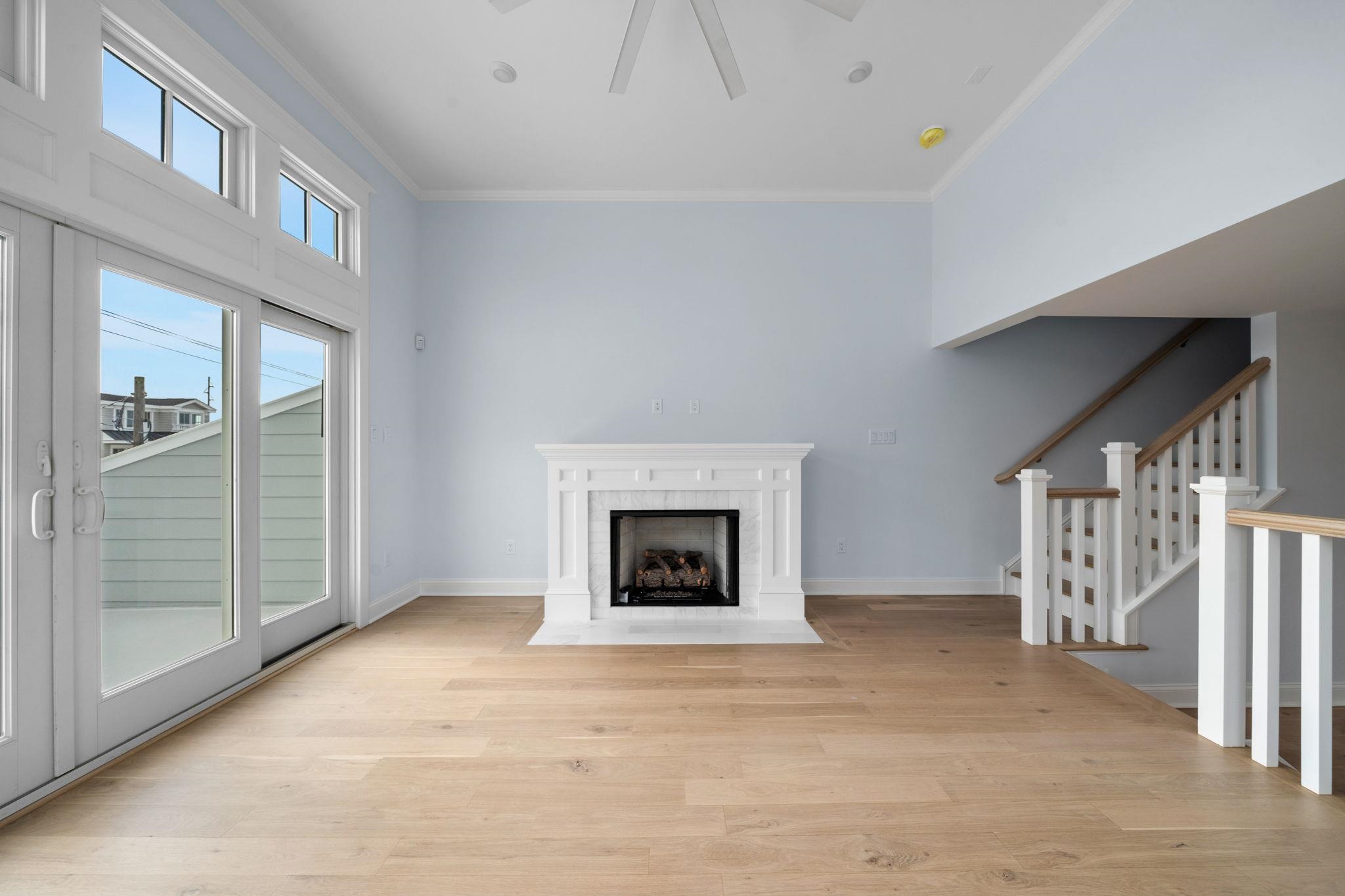 249 35th Street, Unit EAST SIDE Avalon, NJ 08202 - Photo 13 of 45 a view of a livingroom with a fireplace