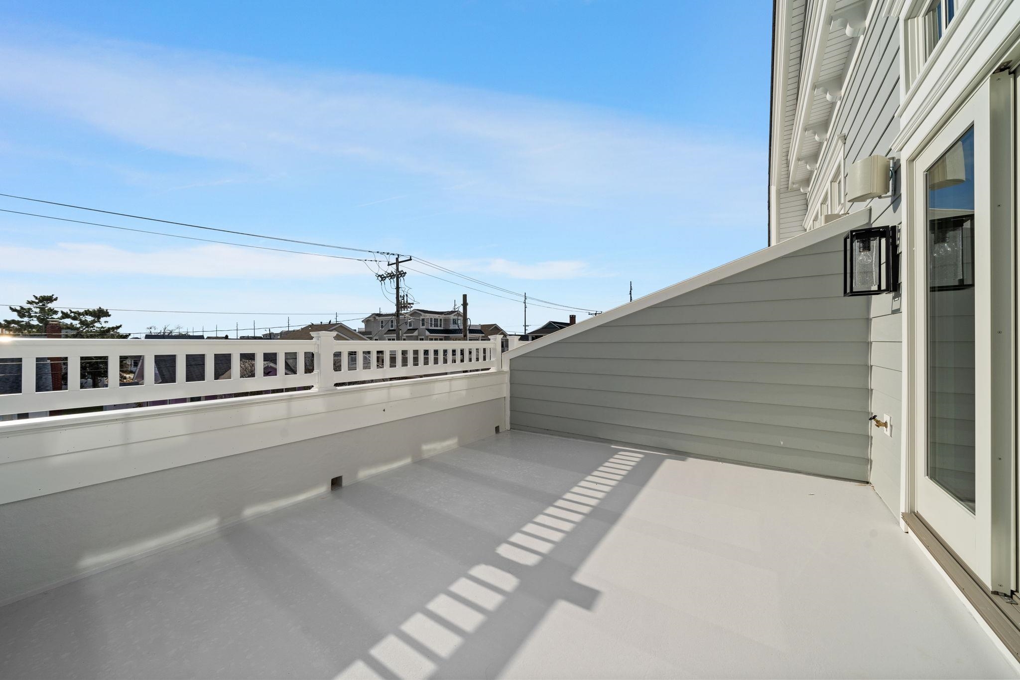 249 35th Street, Unit EAST SIDE Avalon, NJ 08202 - Photo 15 of 45 a view of balcony with an outdoor seating