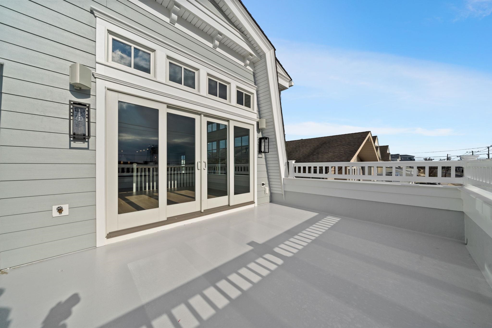 249 35th Street, Unit EAST SIDE Avalon, NJ 08202 - Photo 16 of 45 a view of a building with a street