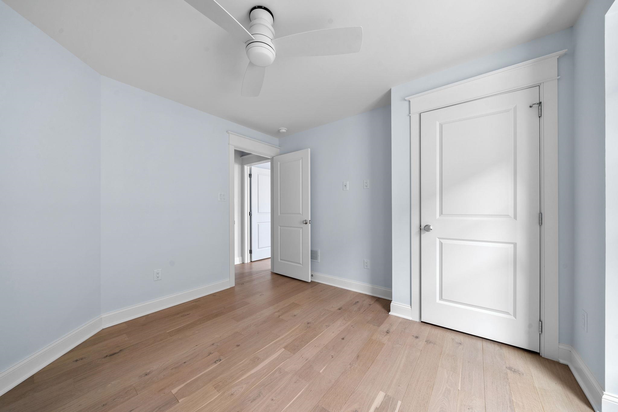 249 35th Street, Unit EAST SIDE Avalon, NJ 08202 - Photo 27 of 45 a view of an empty room with wooden floor