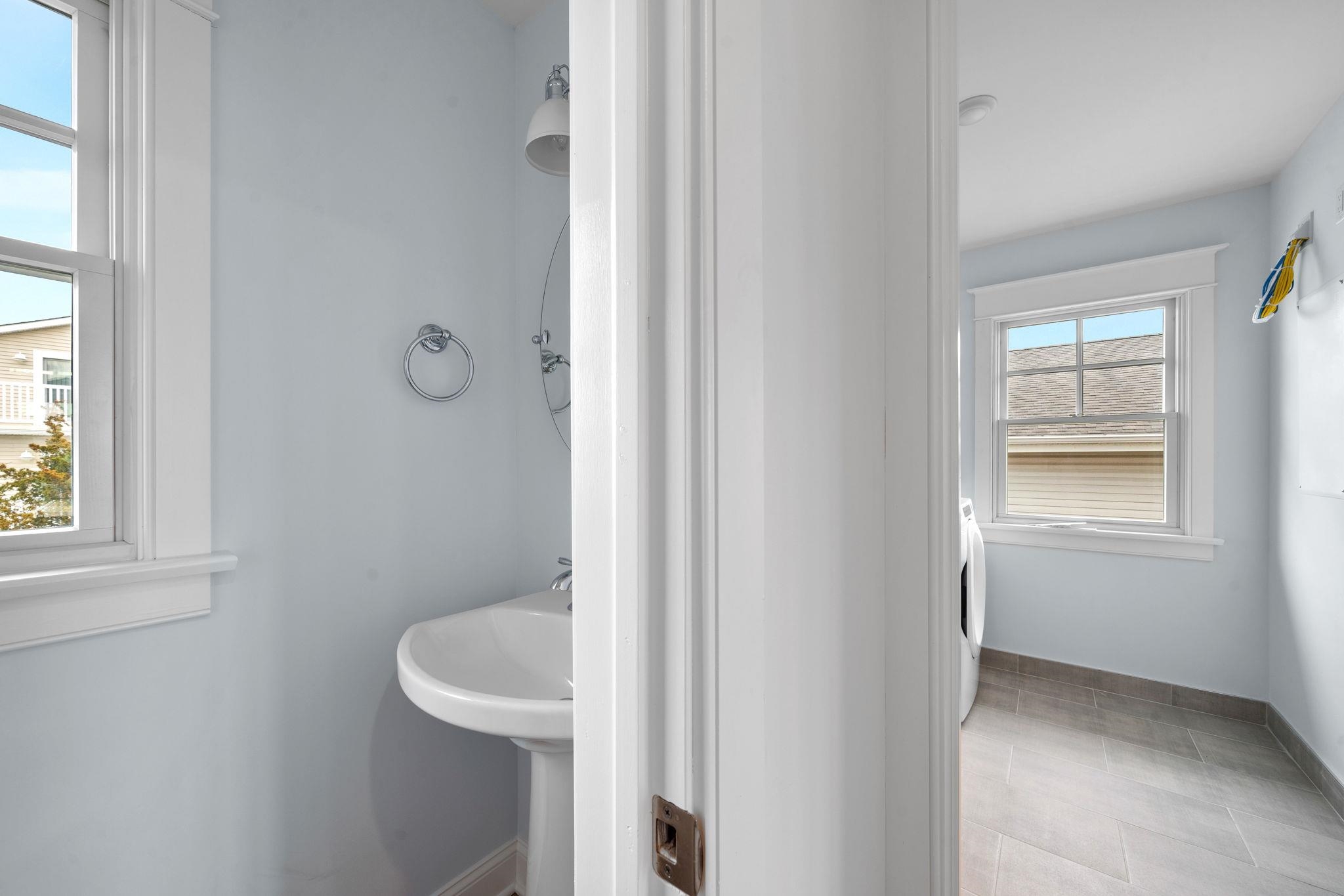 249 35th Street, Unit EAST SIDE Avalon, NJ 08202 - Photo 31 of 45 a bathroom with a sink and toilet