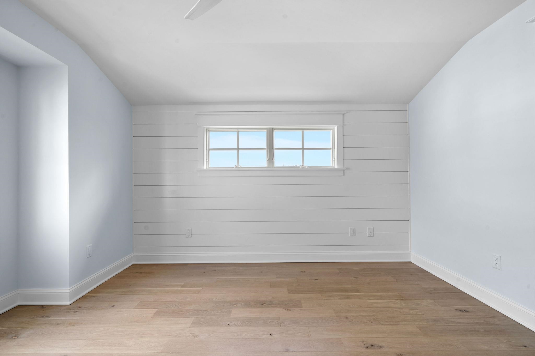 249 35th Street, Unit EAST SIDE Avalon, NJ 08202 - Photo 36 of 45 wooden floor in an empty room
