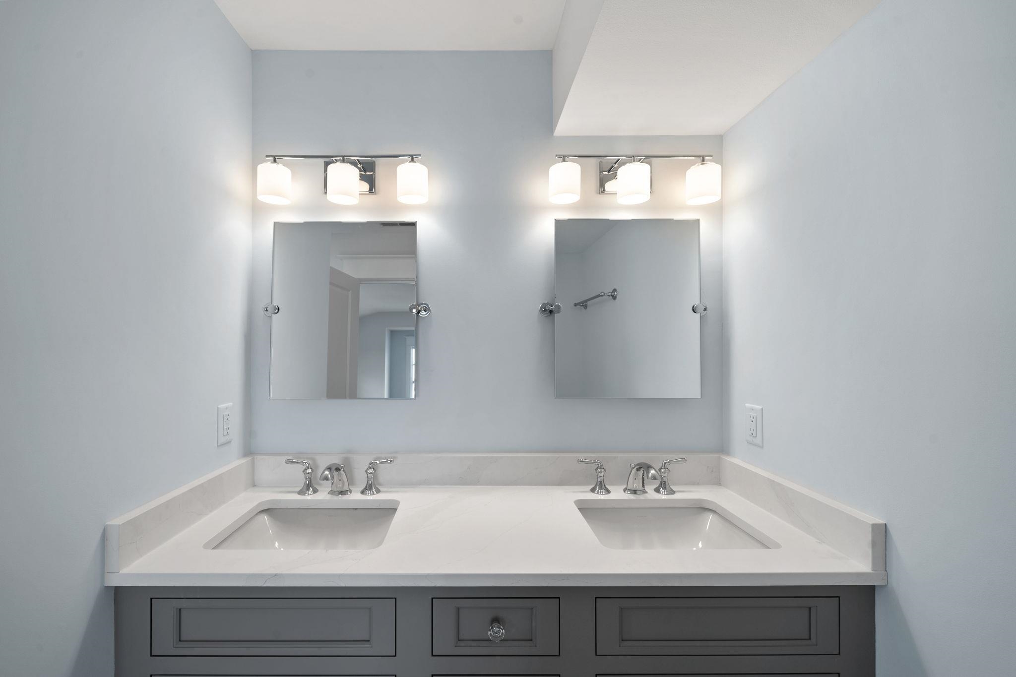 249 35th Street, Unit EAST SIDE Avalon, NJ 08202 - Photo 39 of 45 a bathroom with double sink and a mirror