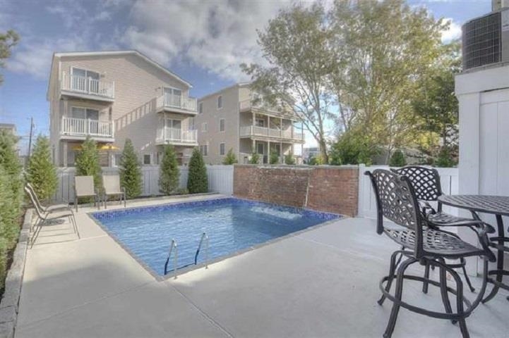 249 35th Street, Unit EAST SIDE Avalon, NJ 08202 - Photo 41 of 45 a view of outdoor space yard deck and patio